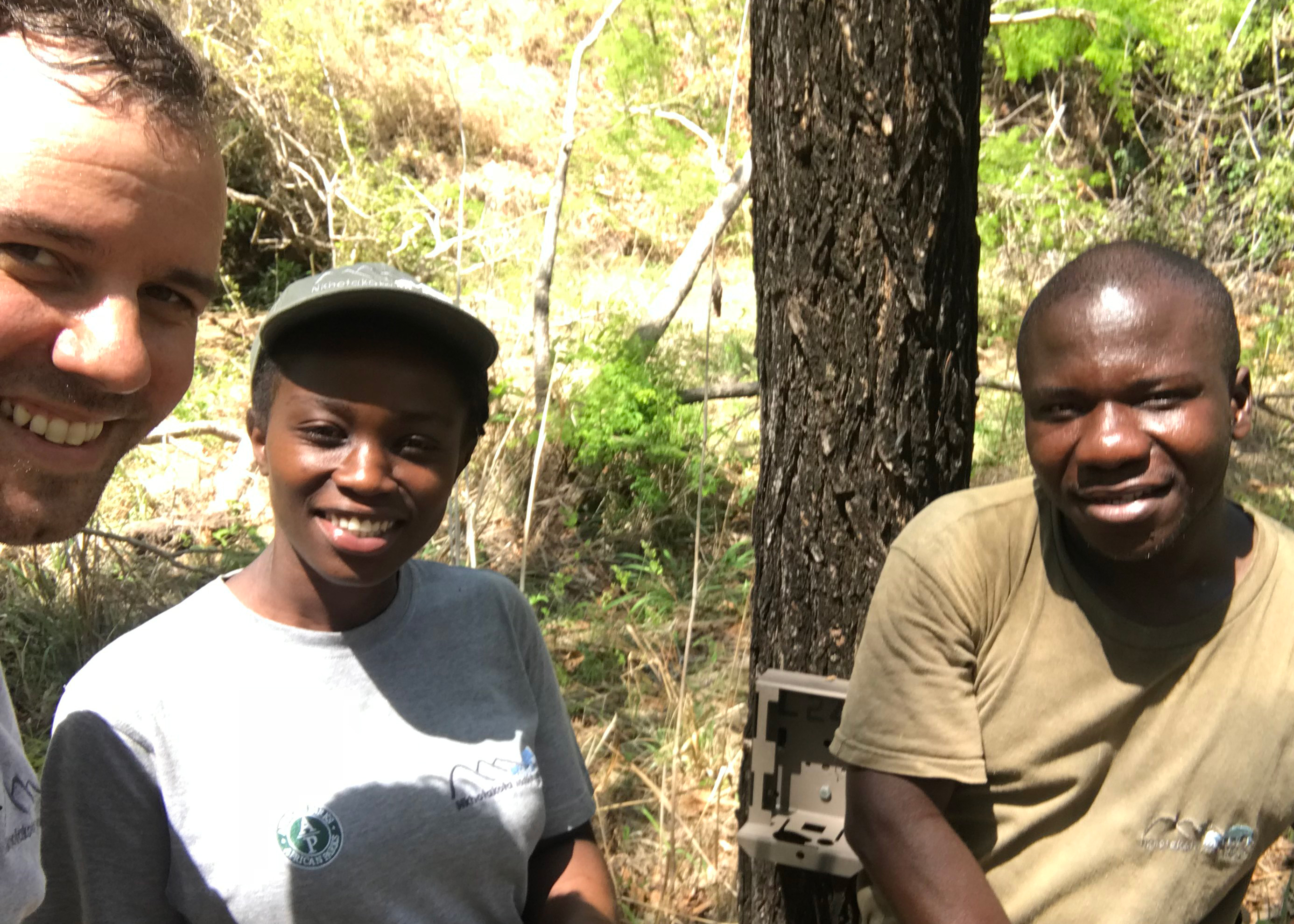 Alexander Dunn is pictured with two members of the African Parks staff