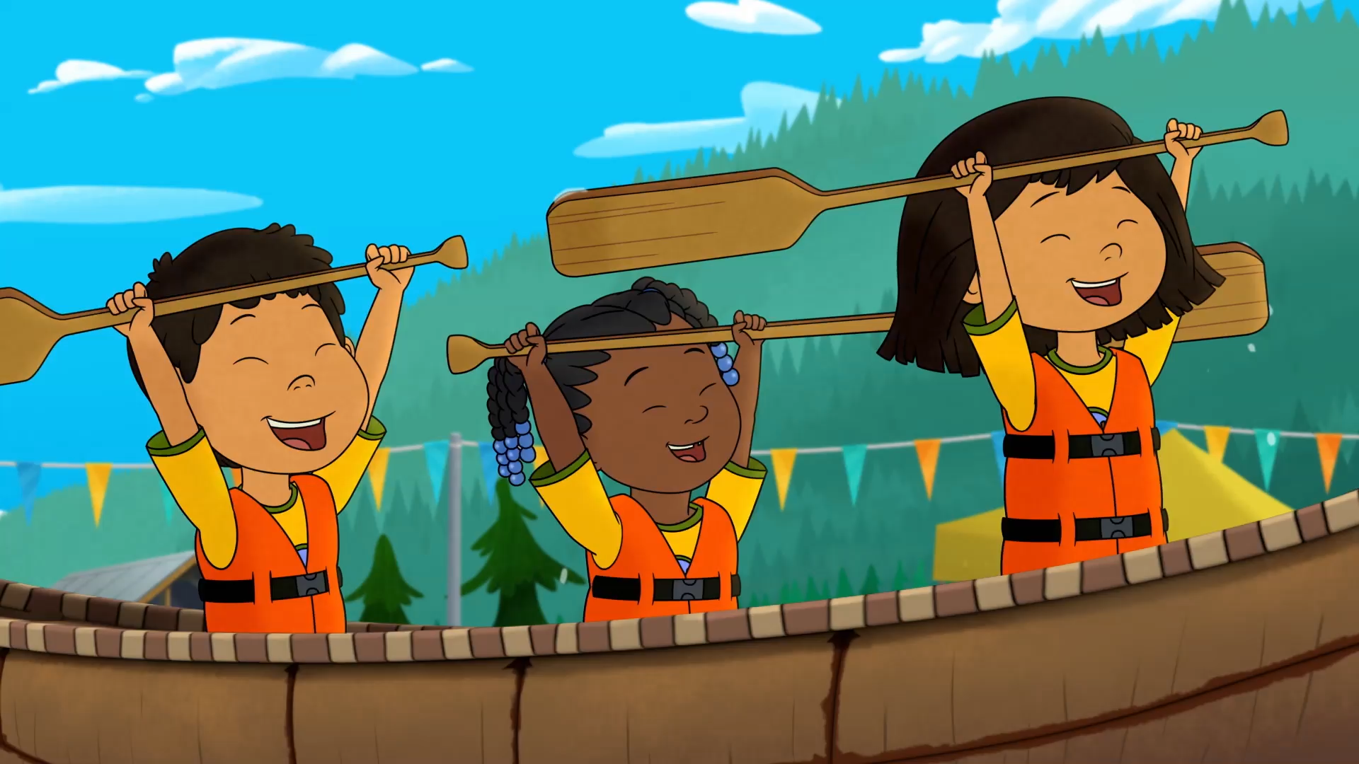 Molly of Denali in a canoe with two friends on the water. They're all raising their oars above their heads.