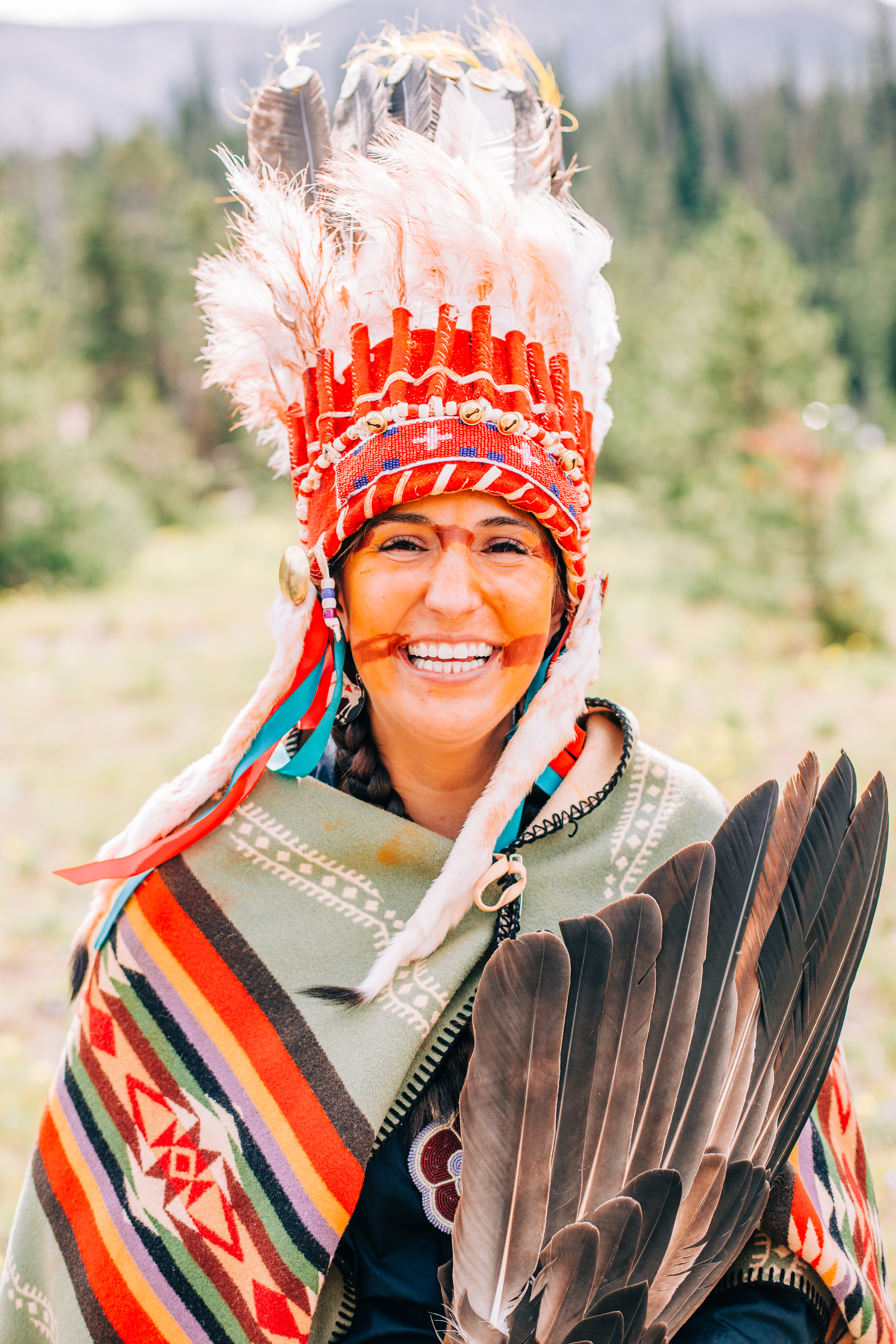 Woman in Indigineous headdress and clothing
