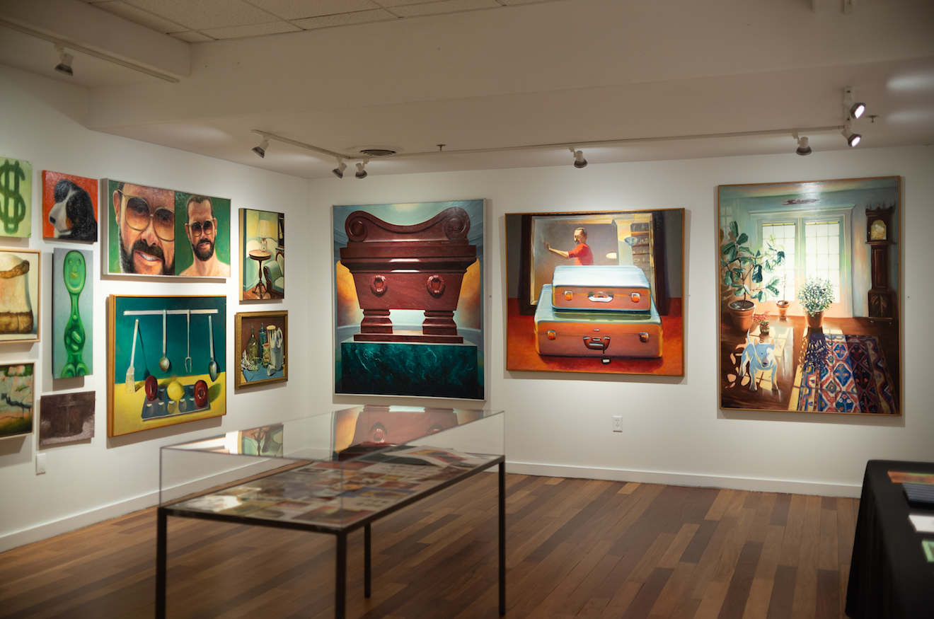 Photograph of paintings on the wall in VanDernoot Gallery