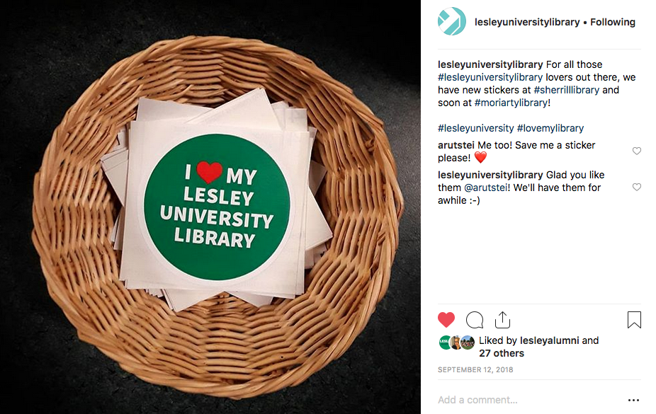 Photograph of a basket full of stickers that read "I love the Lesley University library."