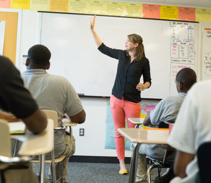 High school teacher in front of a classroom