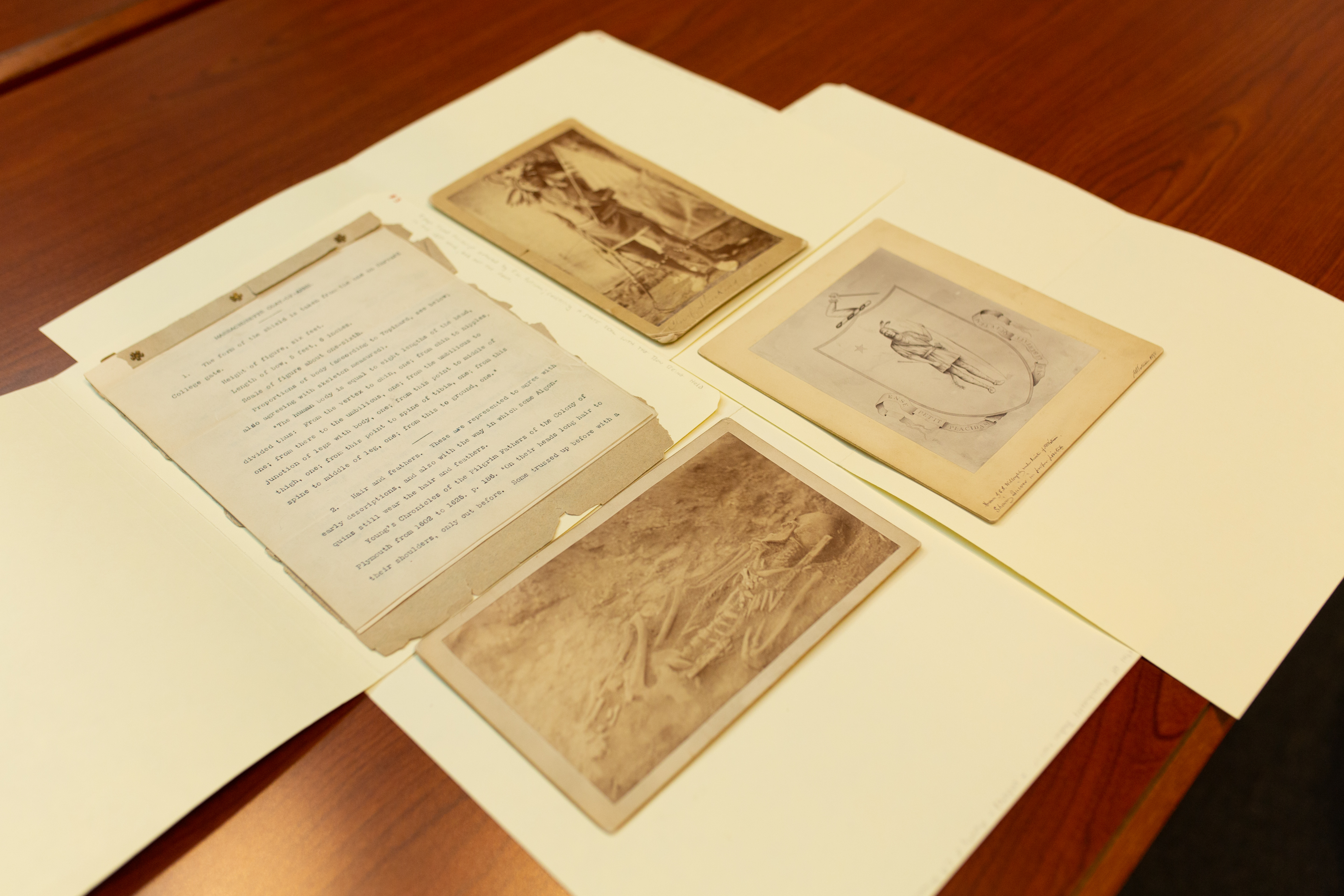 Images from the Massachusetts Archives of Native Americans, including a skeleton, that were referenced for the design of the Massachusetts seal.