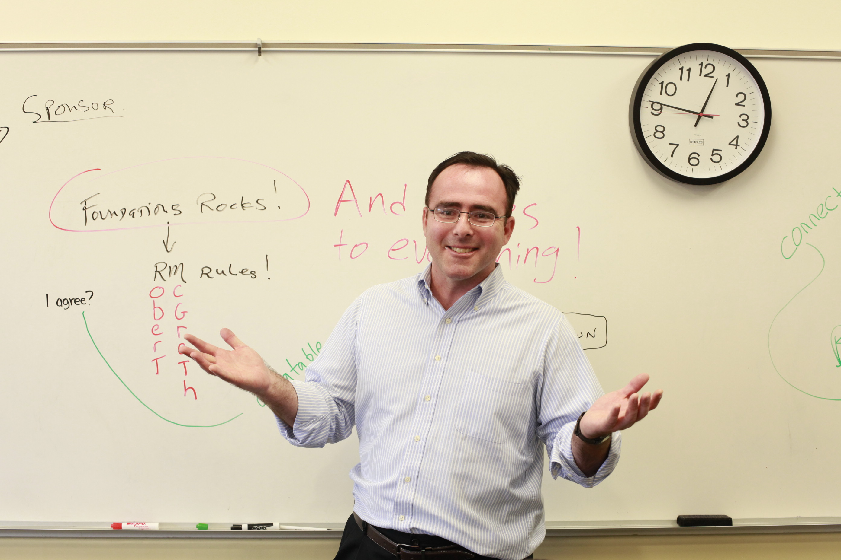 Man in front of whiteboard