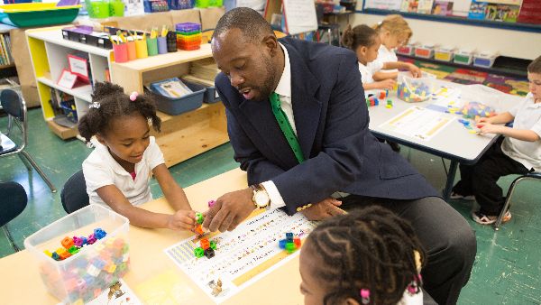 Master's of education student working with child