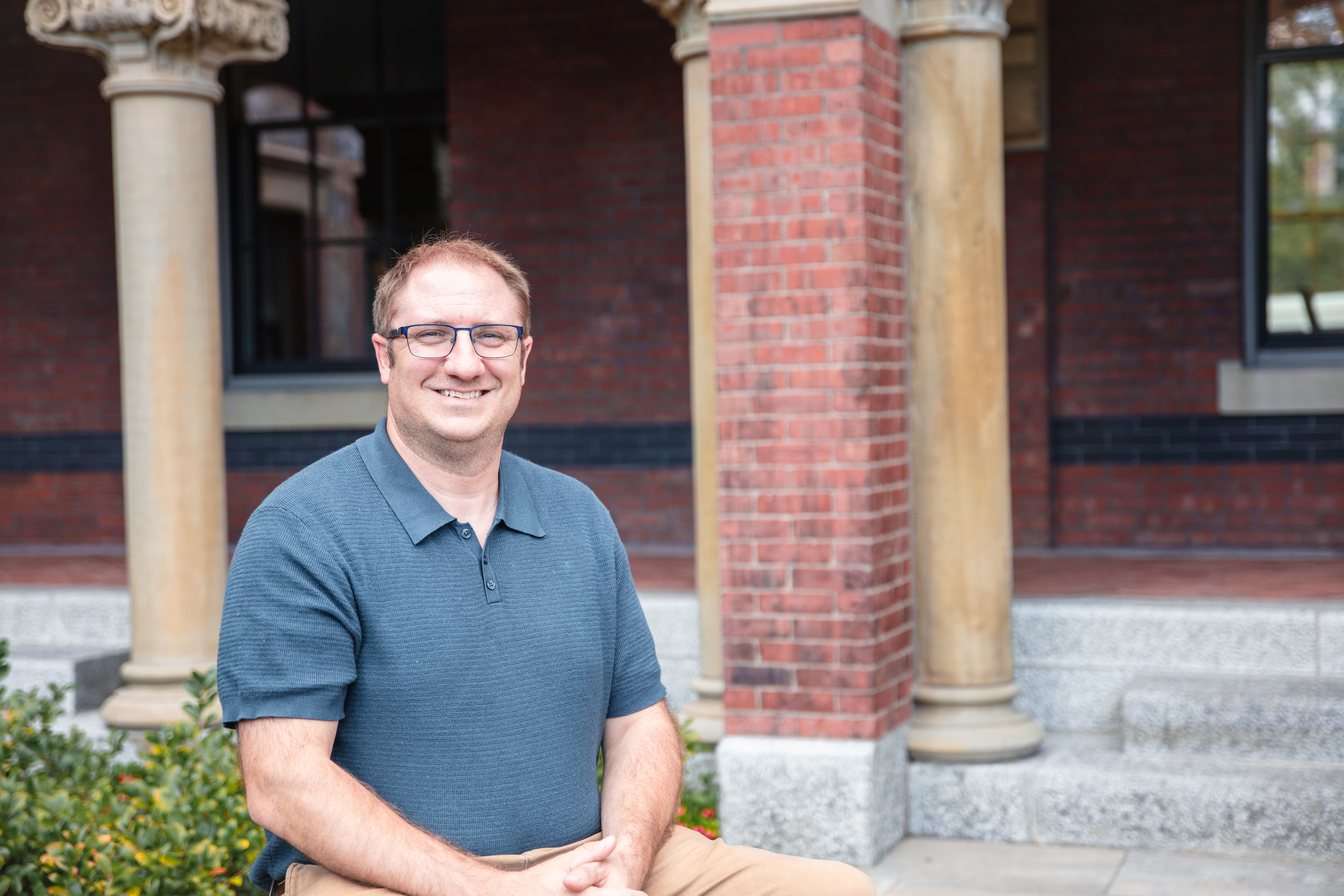 Sean sitting outside smiling