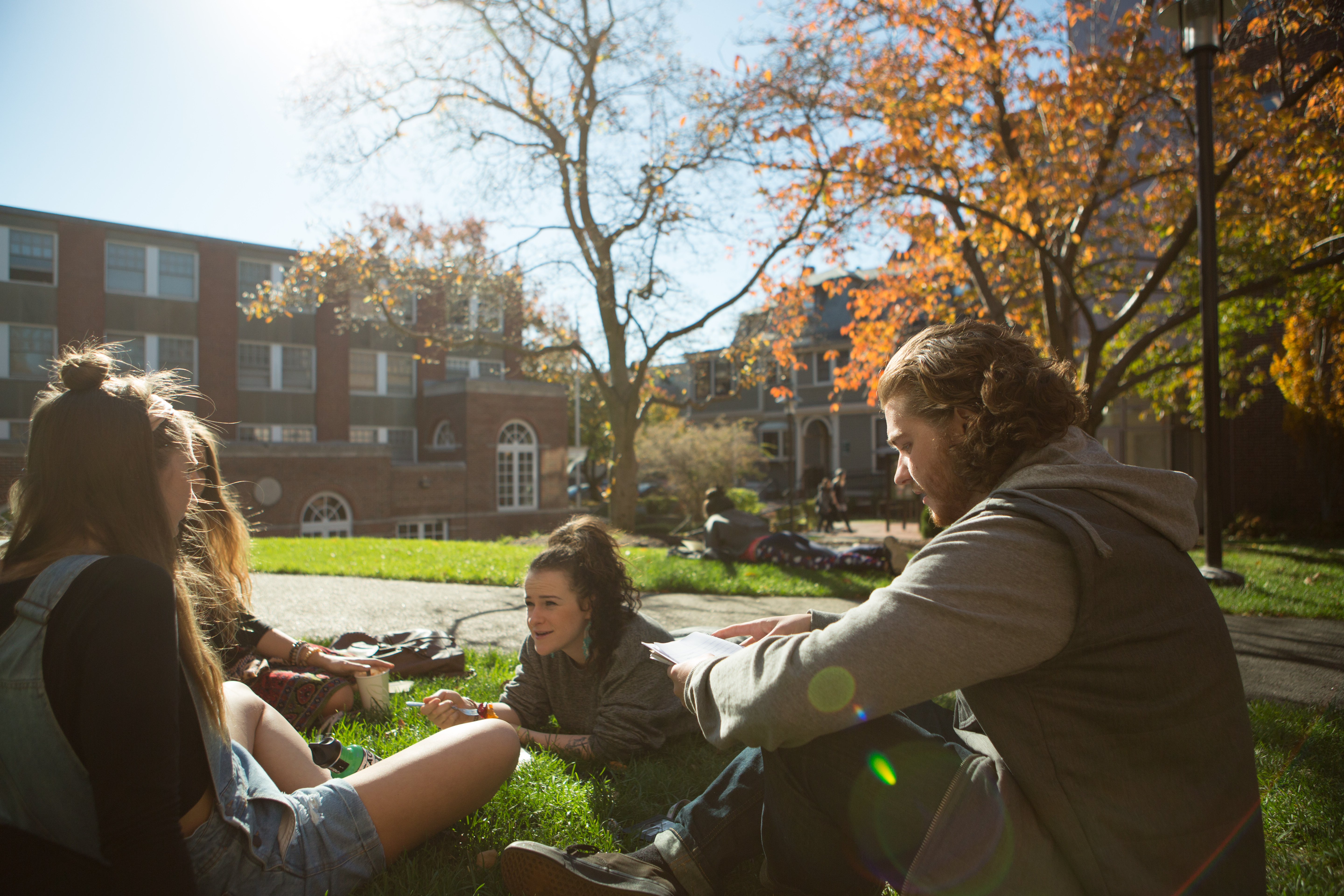 Students on the lawn of the Quad during Autumn