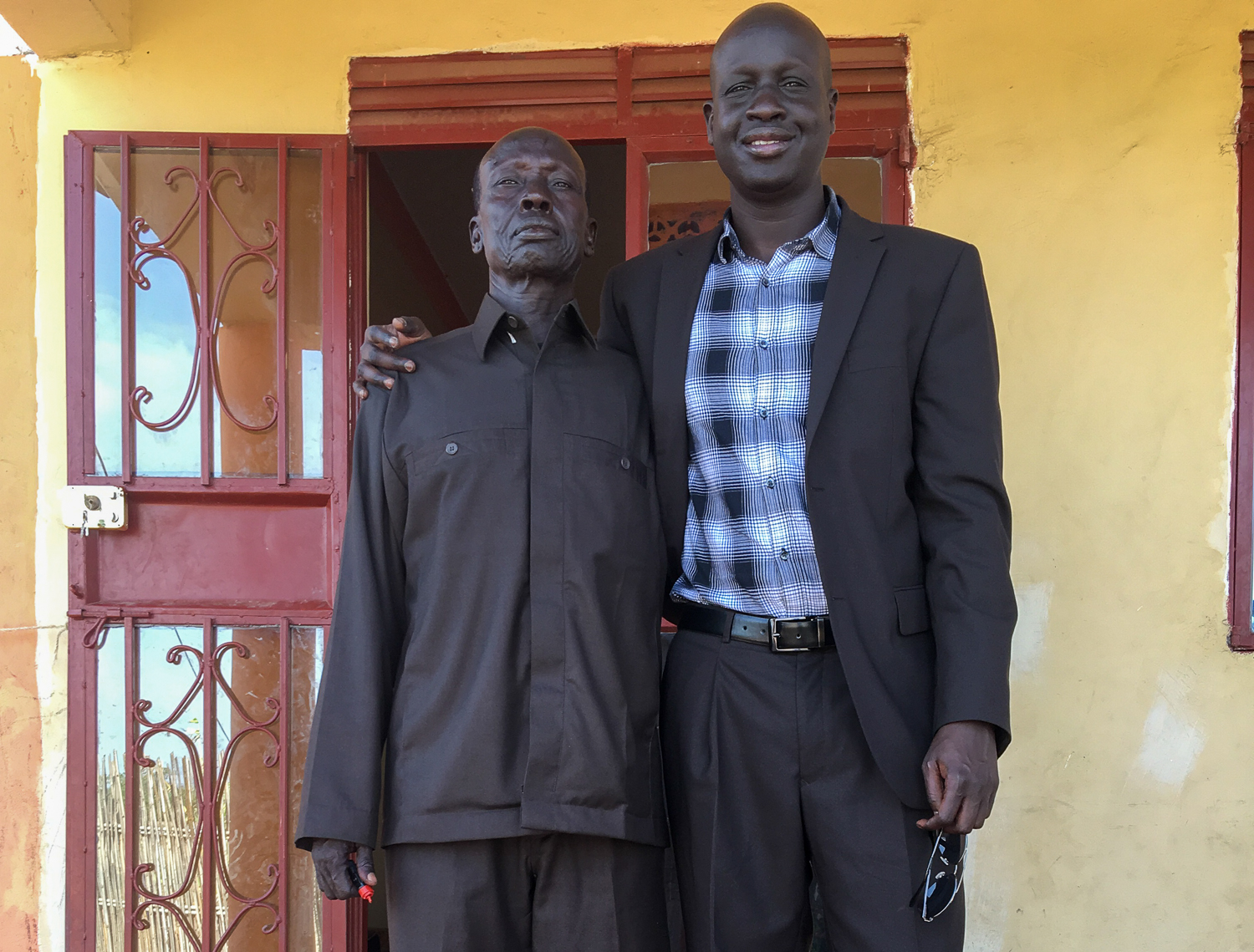 Aleer Deng with his father in Sudan