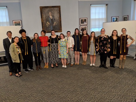 Graduating honors students pose for a group photo in Alumni Hall.