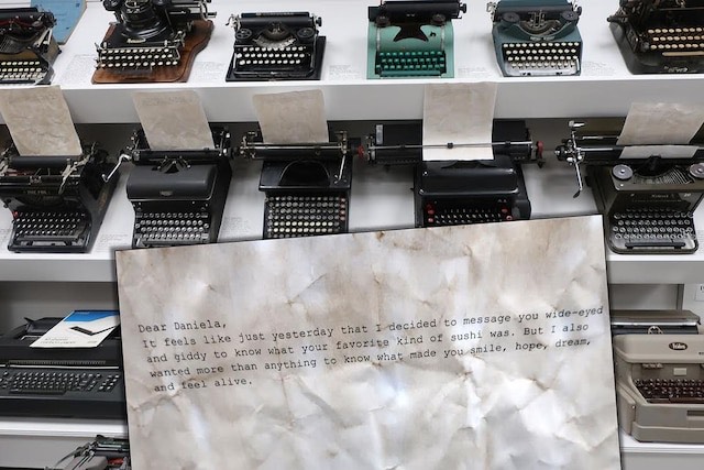 A note set against vintage typewriters
