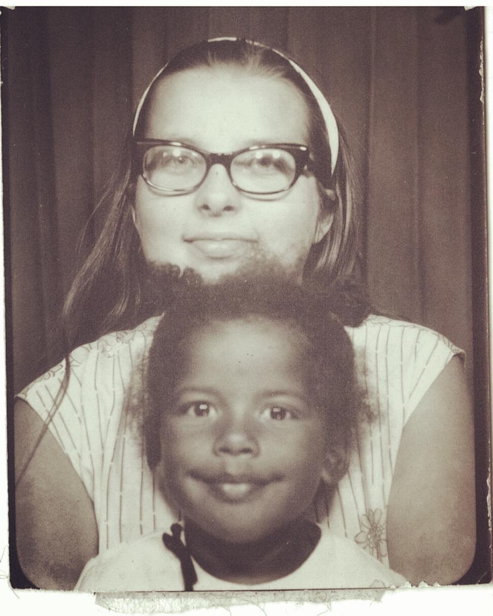 Sepia-toned photo of Faith Adiele with her mother in a photobooth.