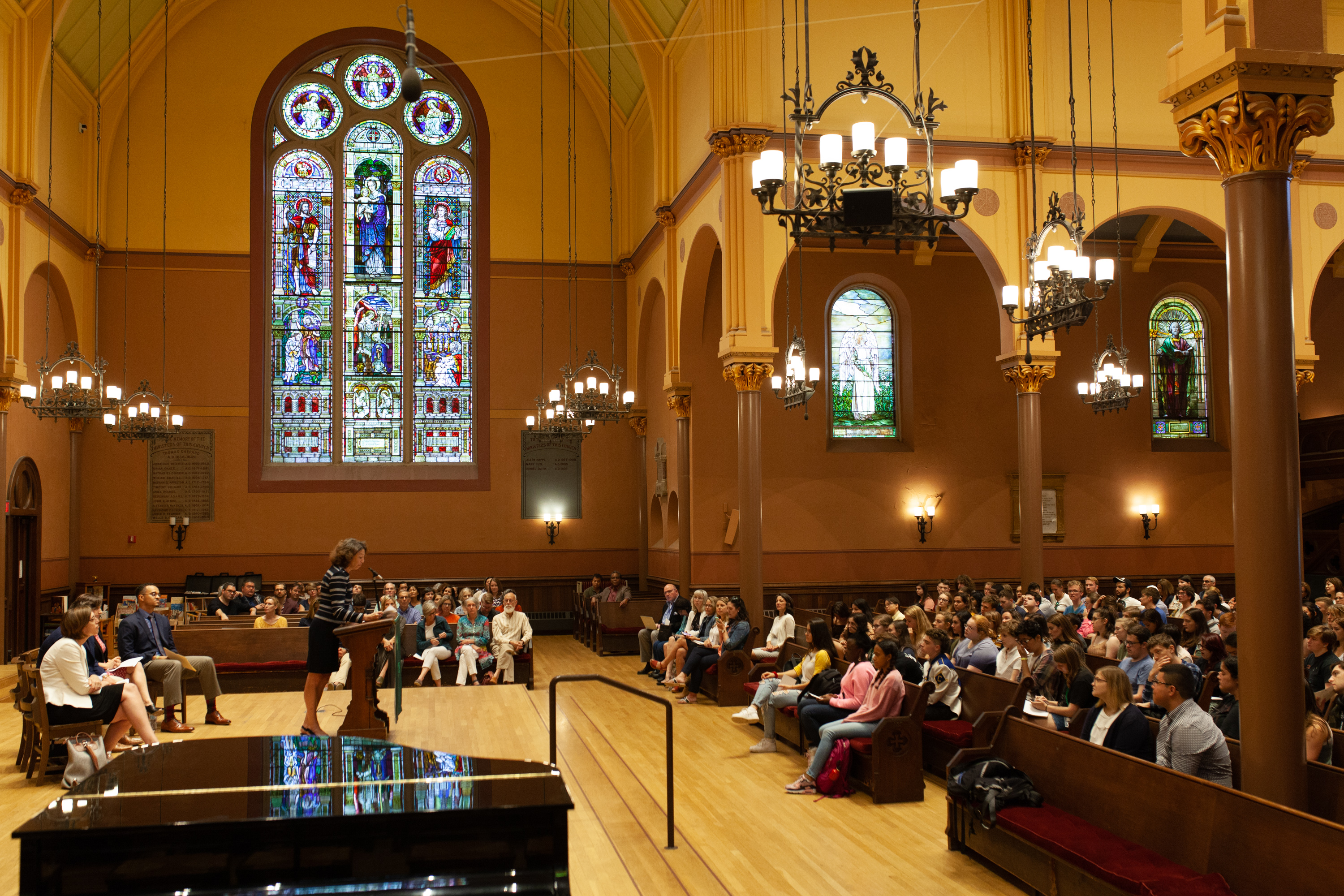 President Steinmayer at the podium addressing the audience at Convocation