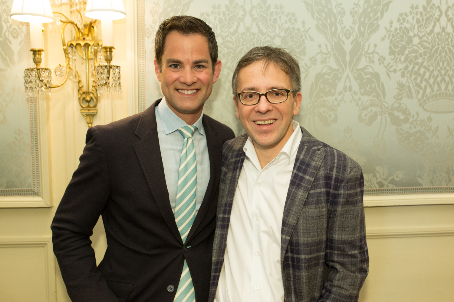 Jaren Bowen and Ian Bremmer stand together and smile for the camera