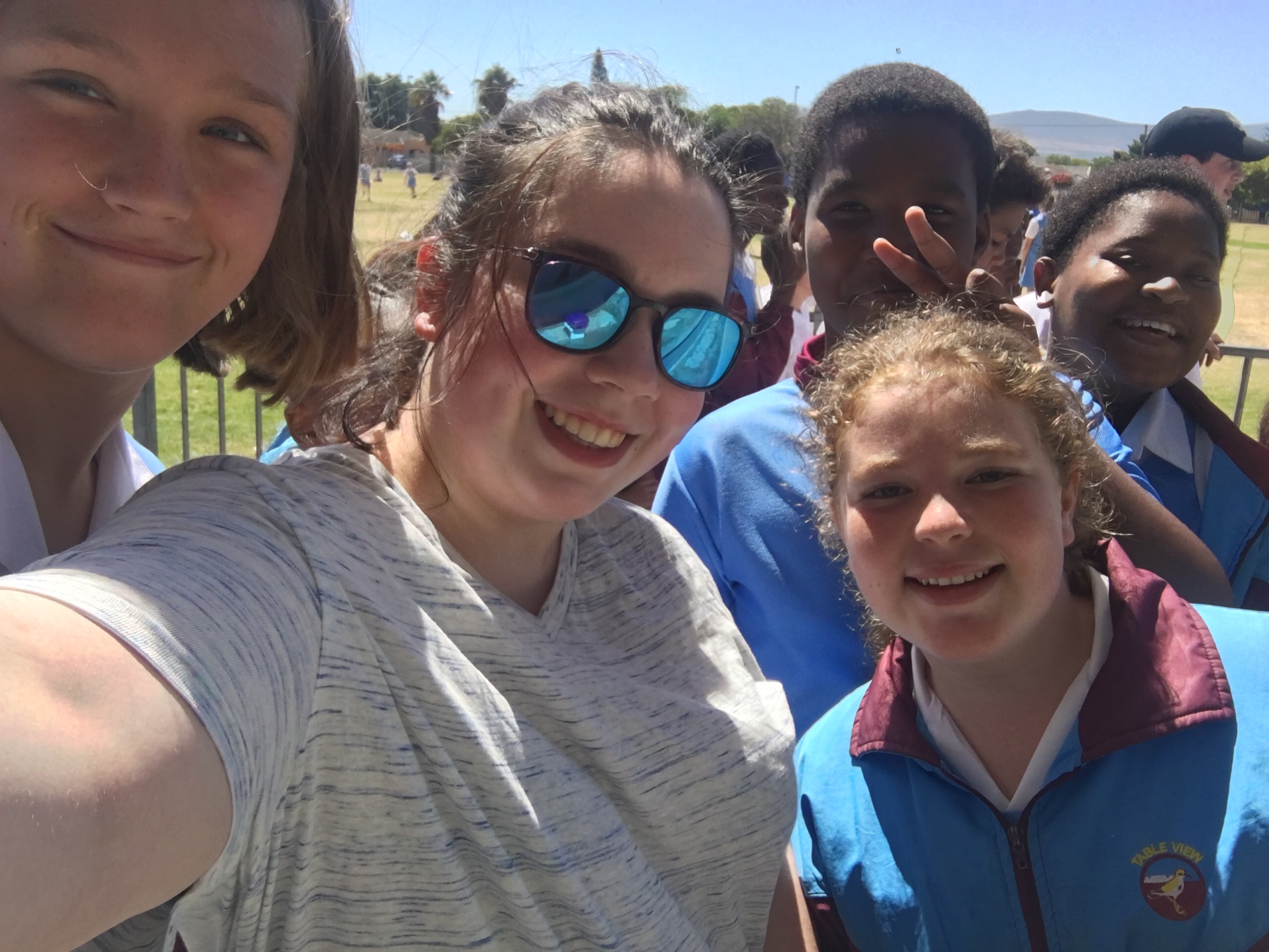 Julia Caruso in South Africa - selfie with four other people.