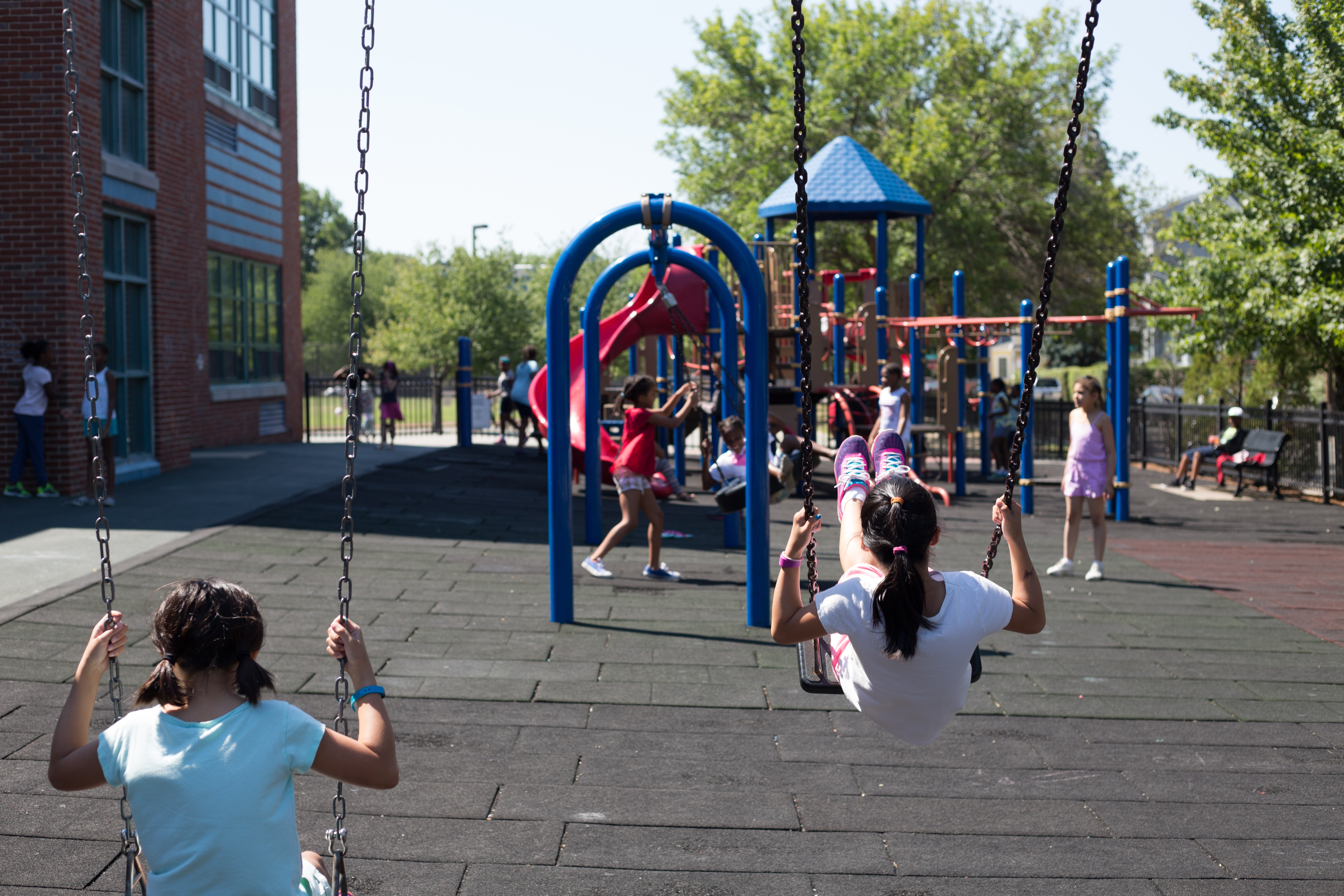 Kids swinging on a school playground