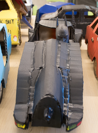 A Batmobile made by a student complete with Batman at the wheel.