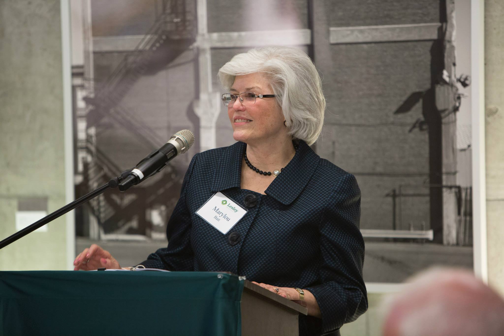 Marylou Batt speaking at a podium