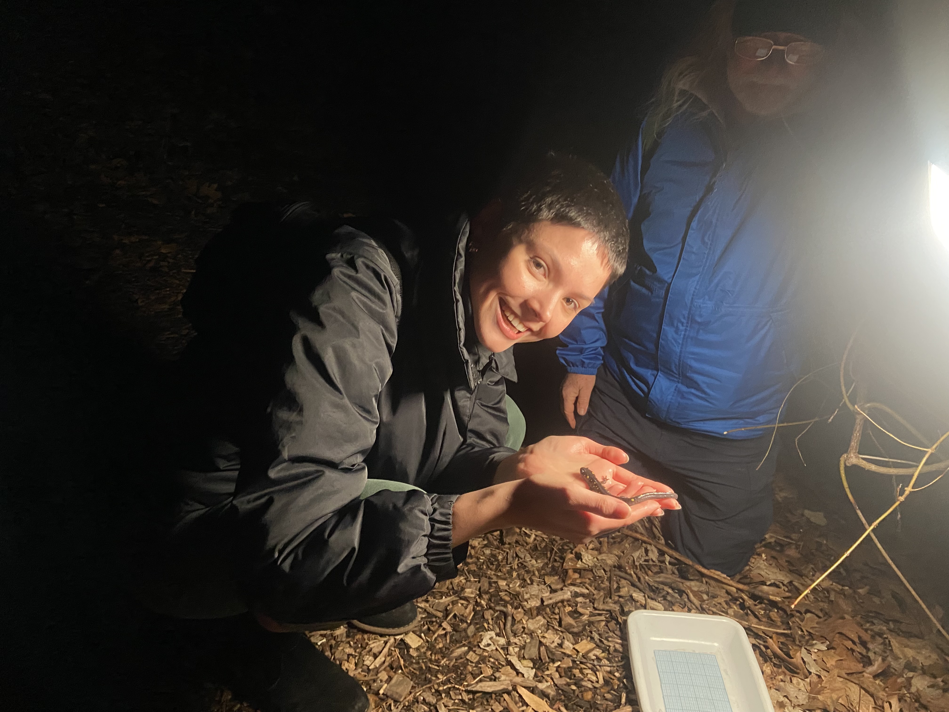 Ecologist Mina Burton '21 with a spotted salamander