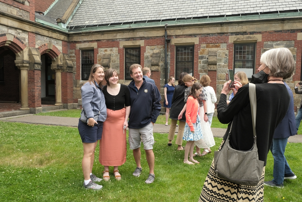 students pose for photos