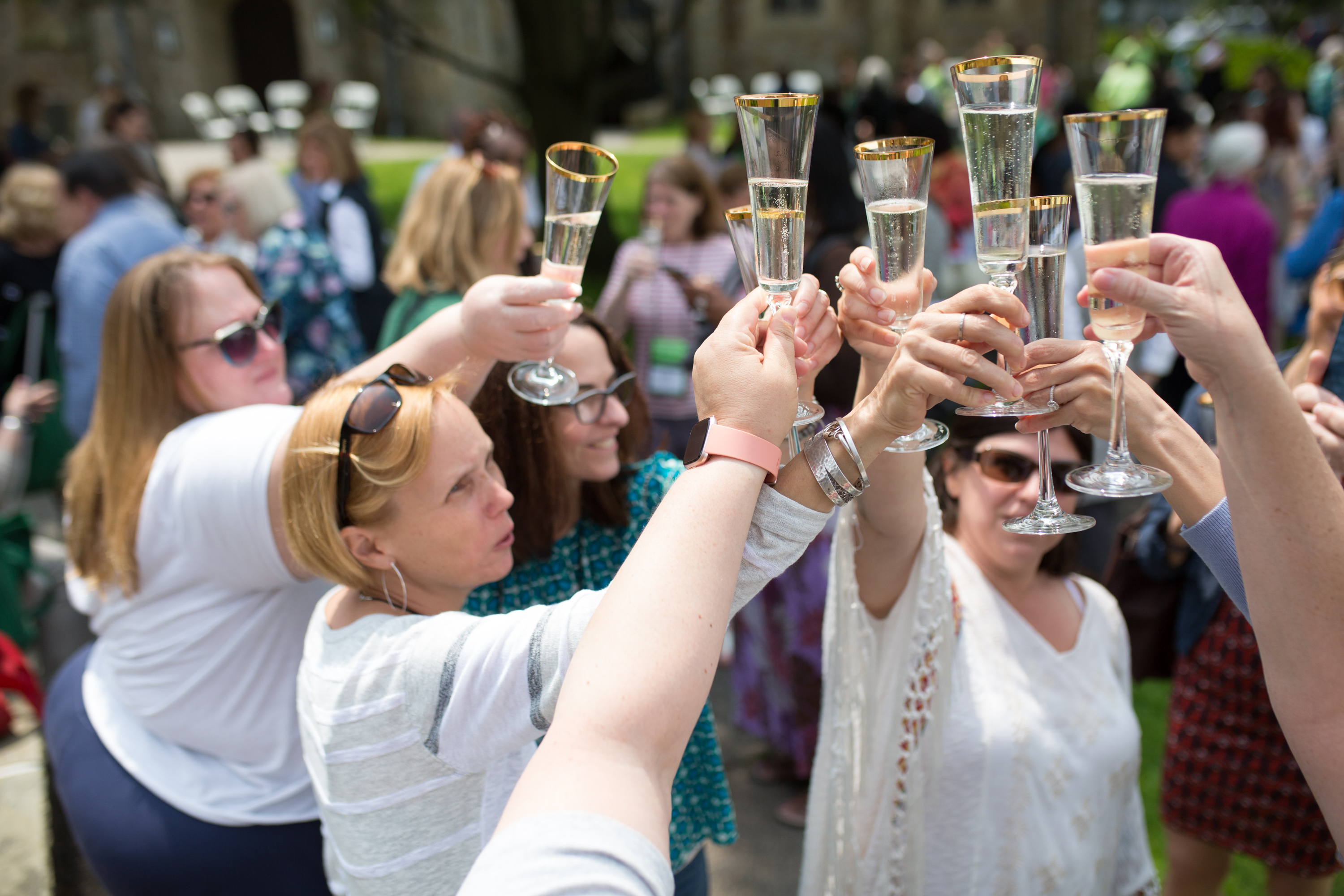 Women raising a class to toast