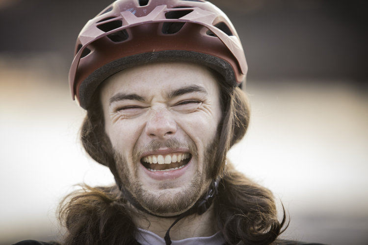 Brendan Walsh smiling with his helmet on.