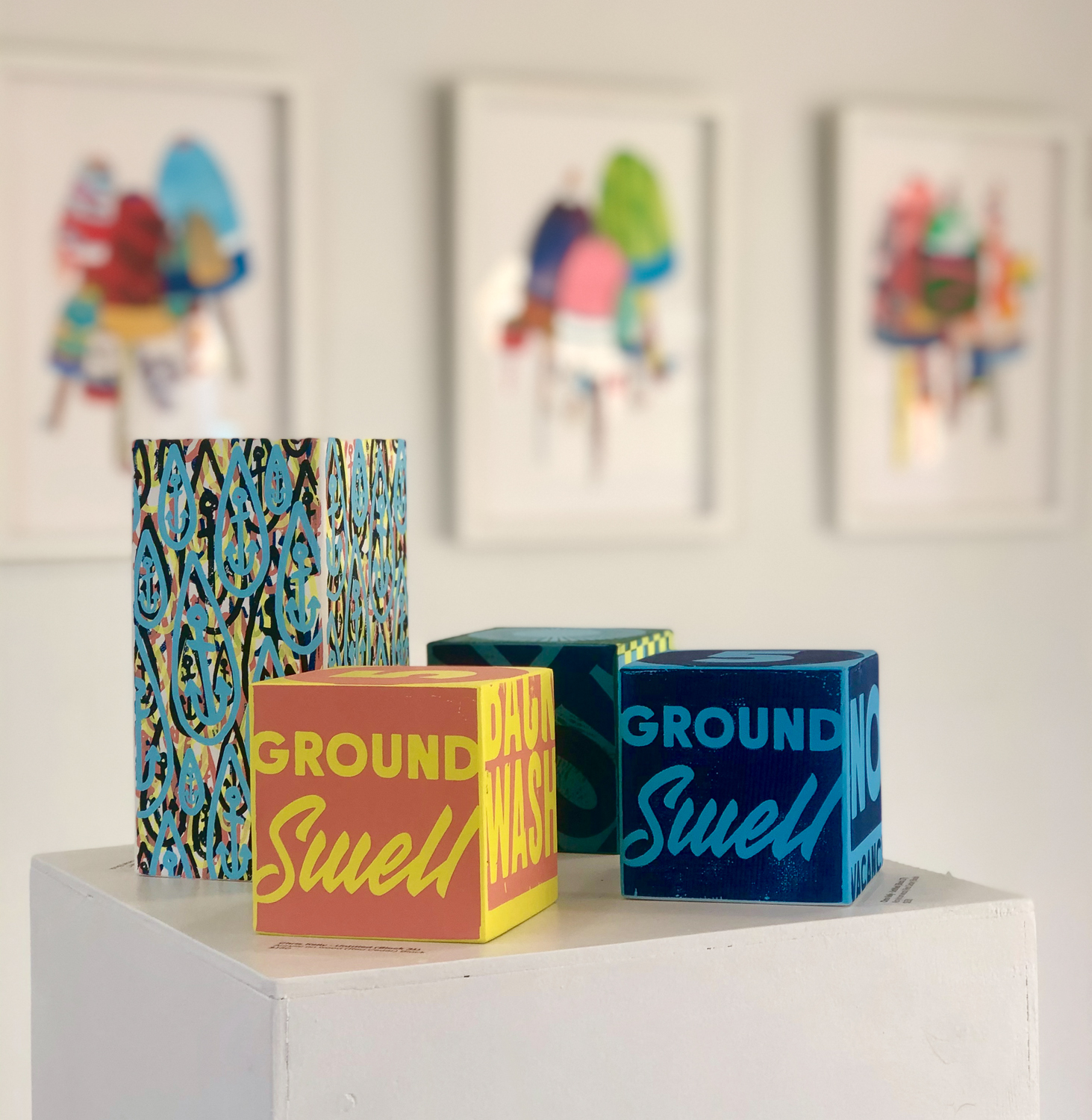 Boxes with graphic designs in art gallery