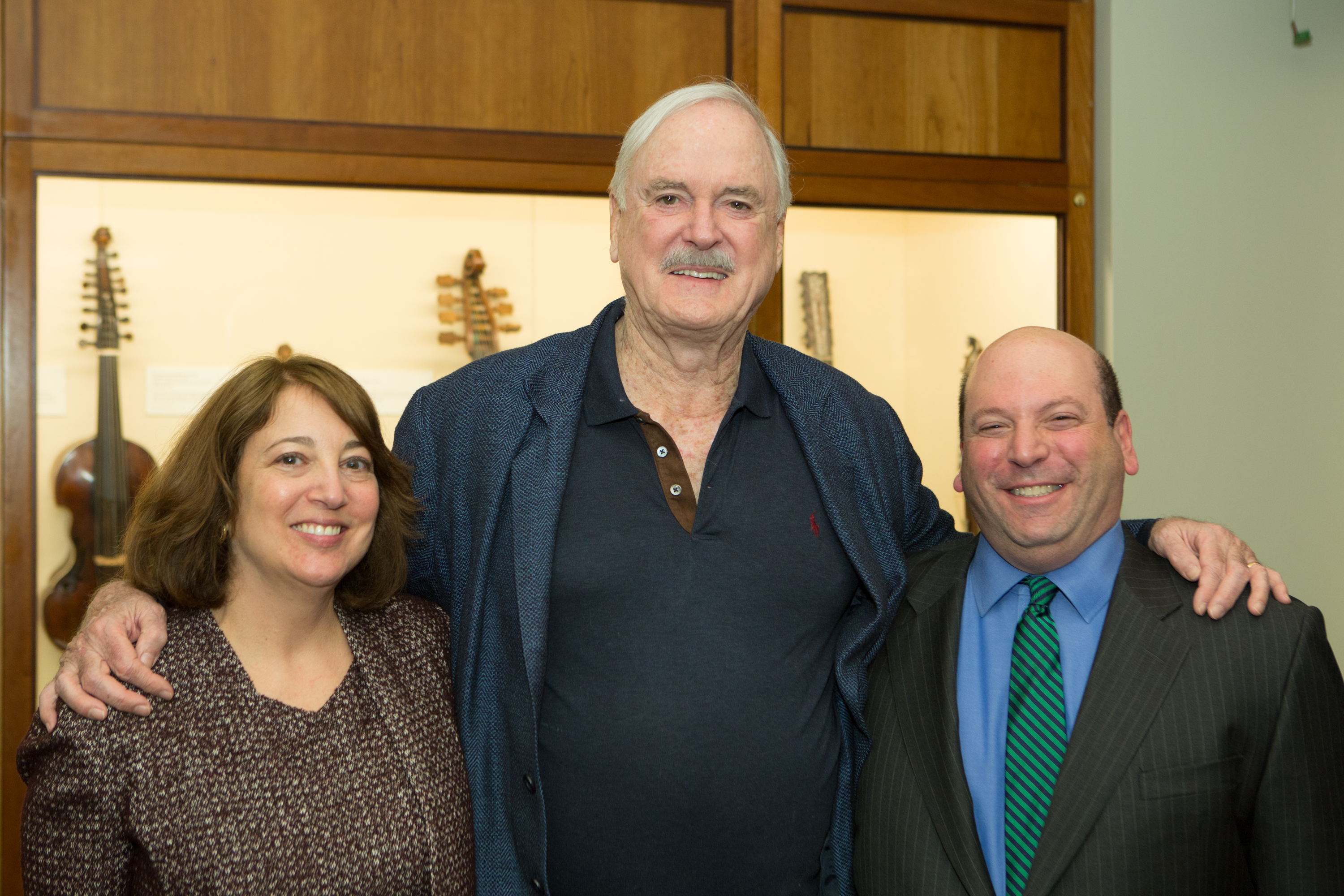 Comedy icon John Cleese stands with Gerri and President Jeff Weiss.