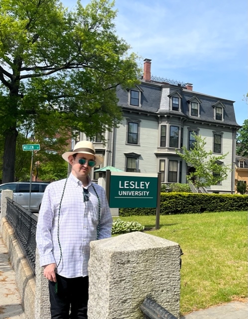 Daniel Dubinsky wearing Panama hat in front of Founder's Hall