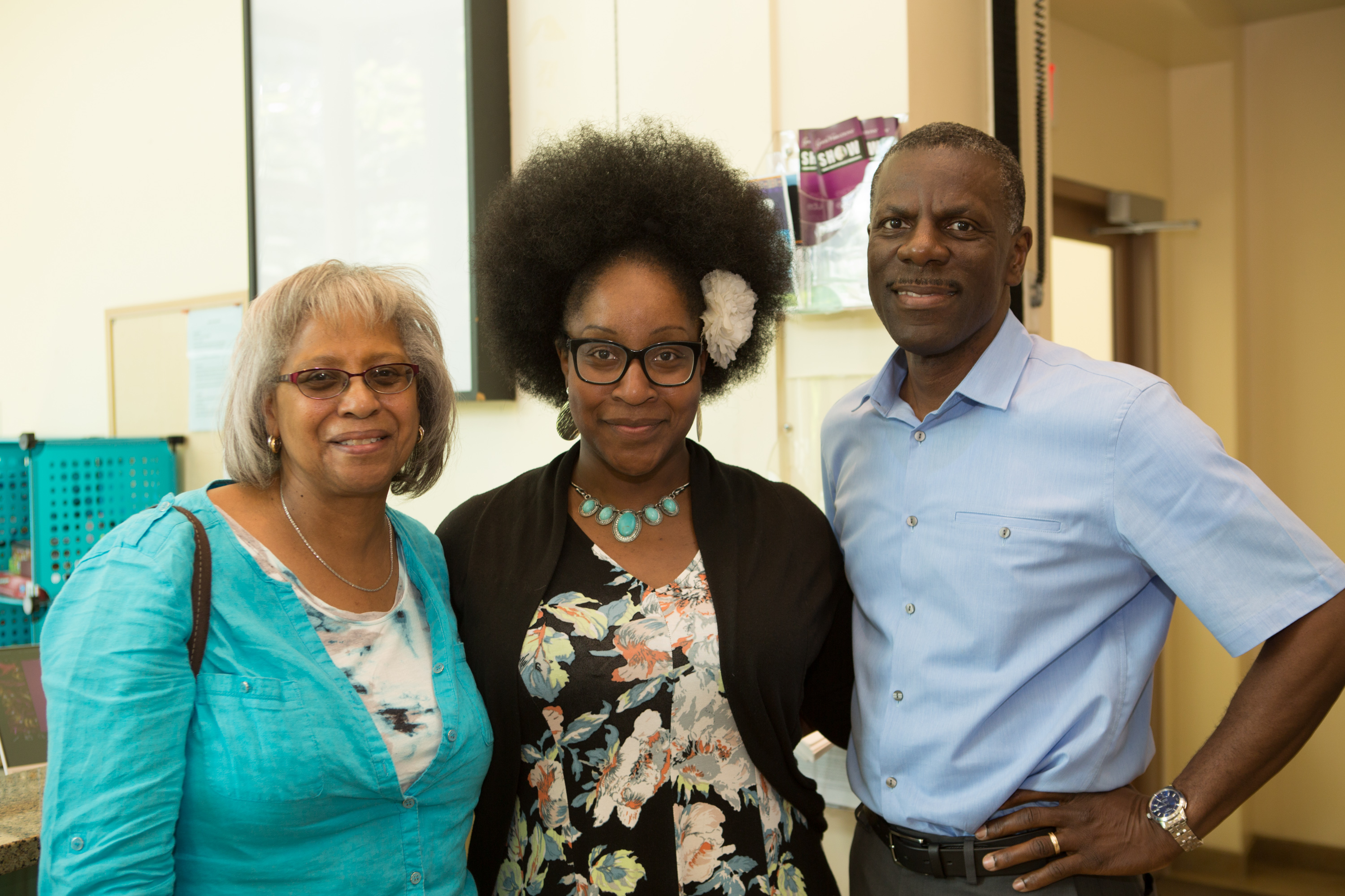 Retiring Associate Professor Janel Lucas with Bwann Gwann and Rodney Daniels together at a party in the Student Center