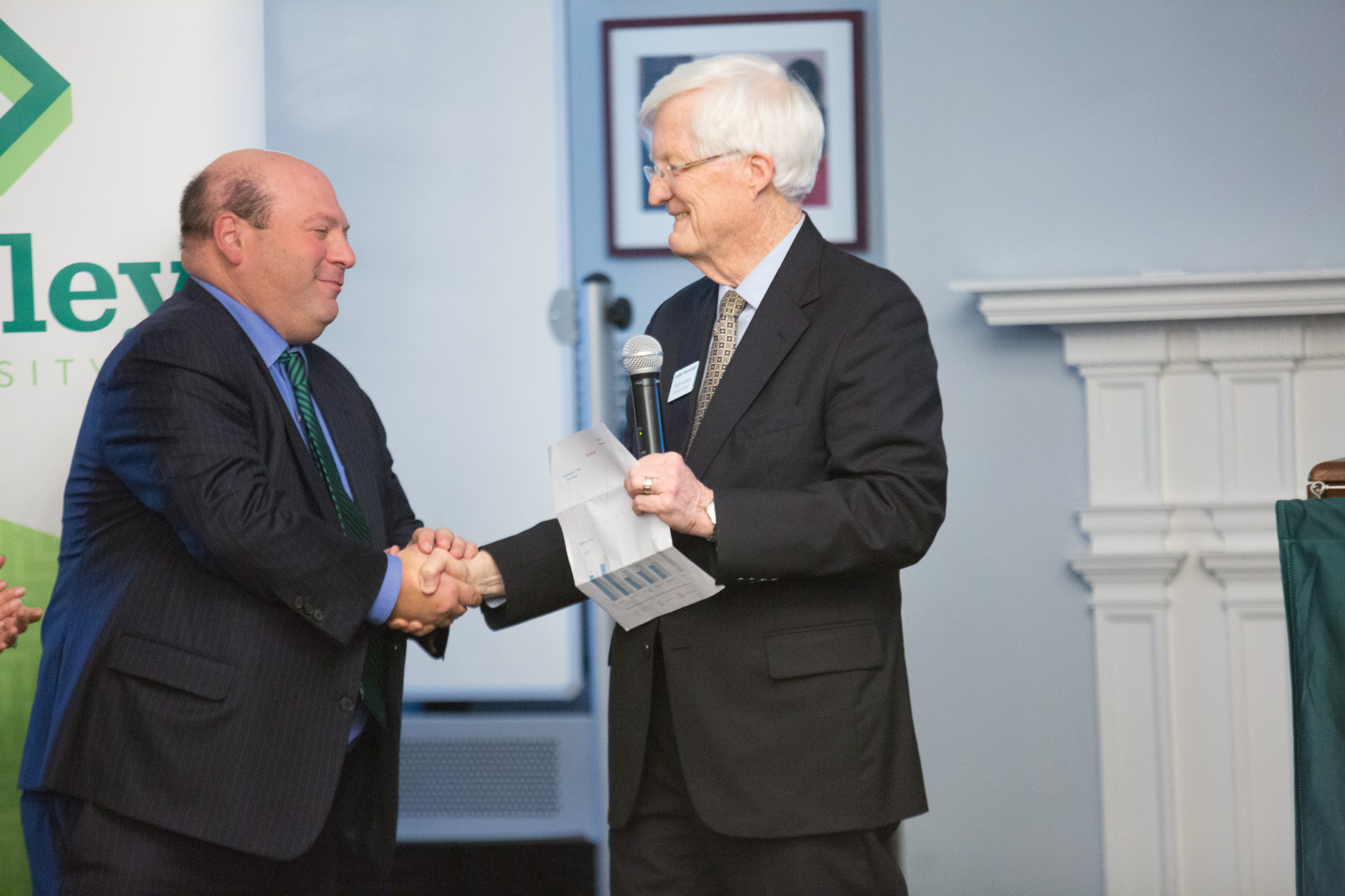 Jeff shakes hands with Interim President Rich Hansen.