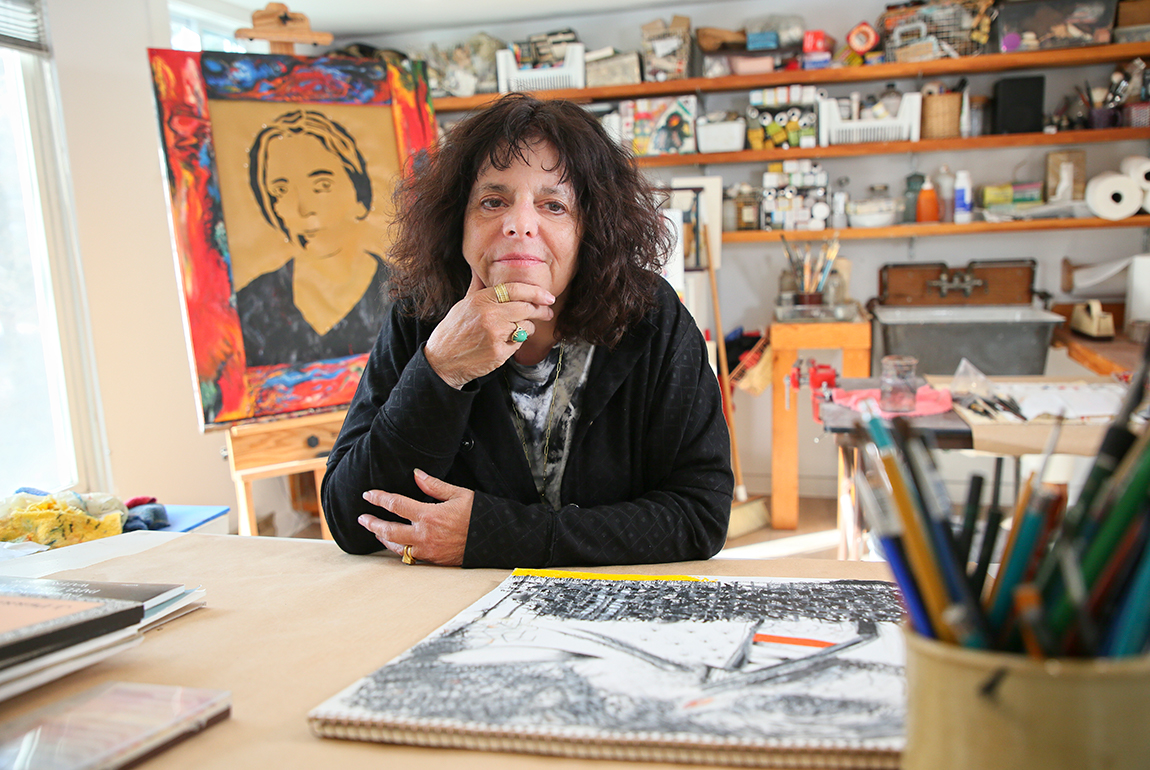A photo of Expressive Therapies Professor Karen Frostig in an art studio.
