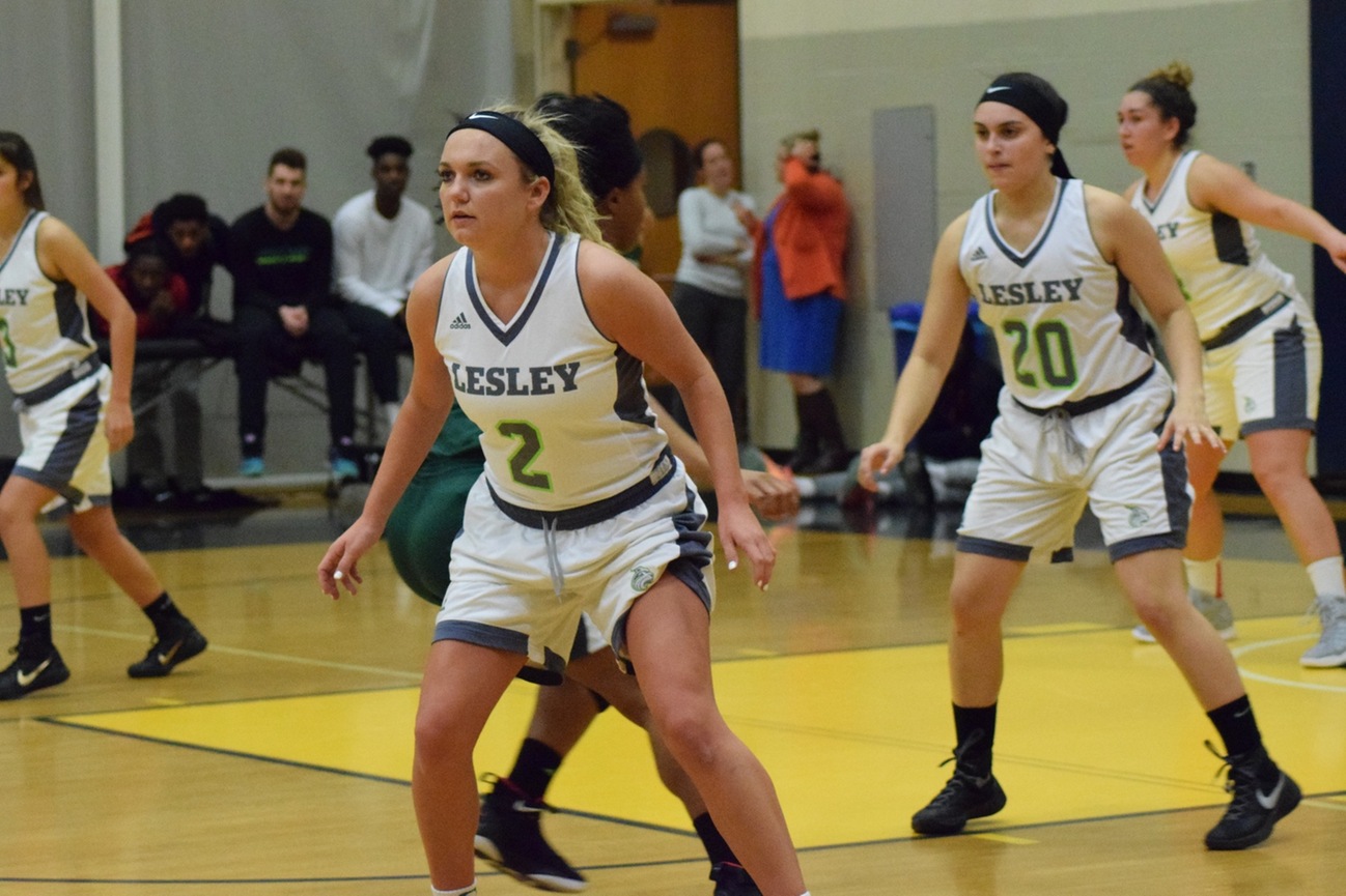 Lesley women's basketball team playing on the court.