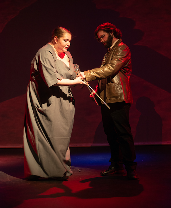 2 actors playing Lady Macbeth and Macbeth holding a dagger on stage in Marran Theater