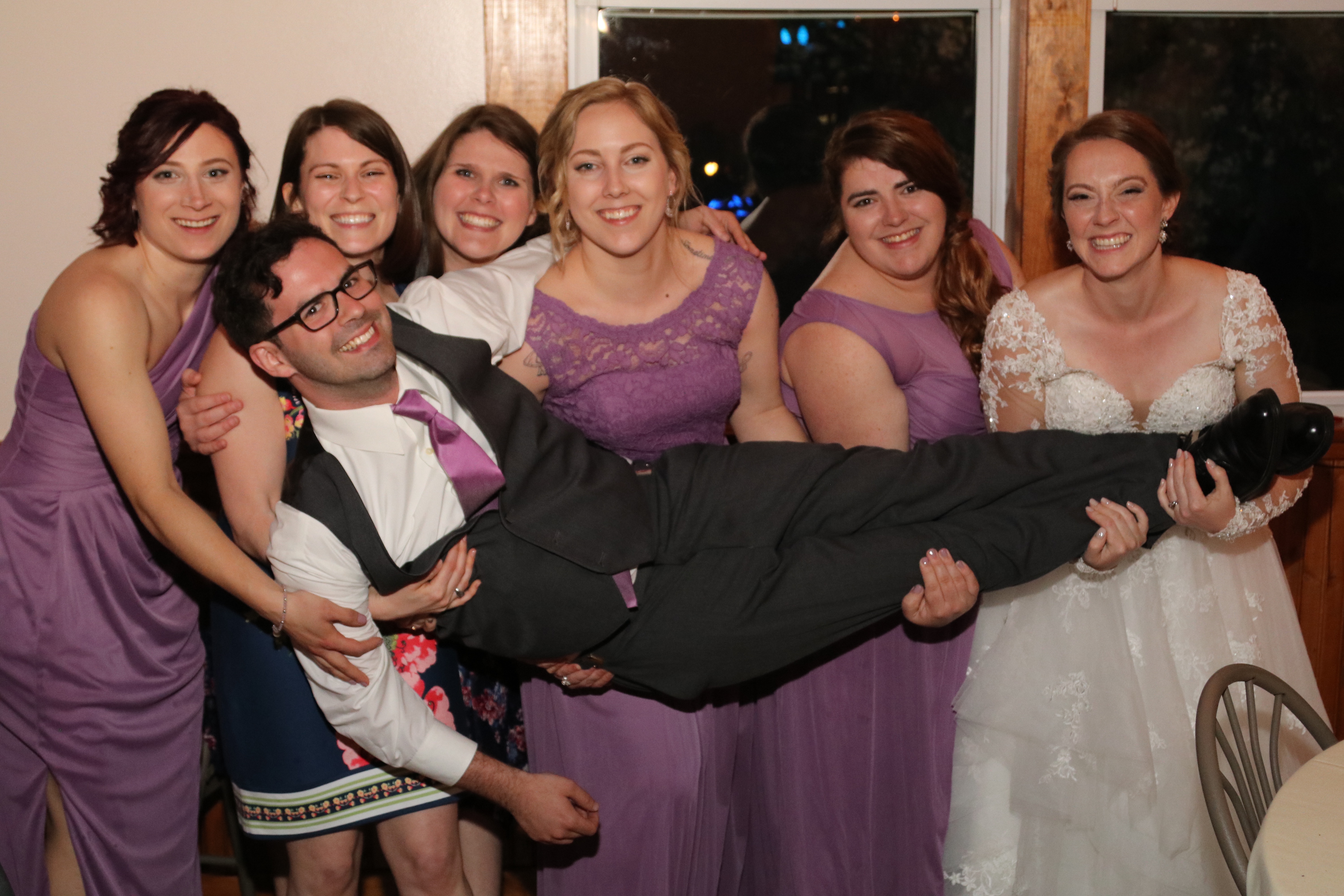 A group of friends are pictured at a wedding