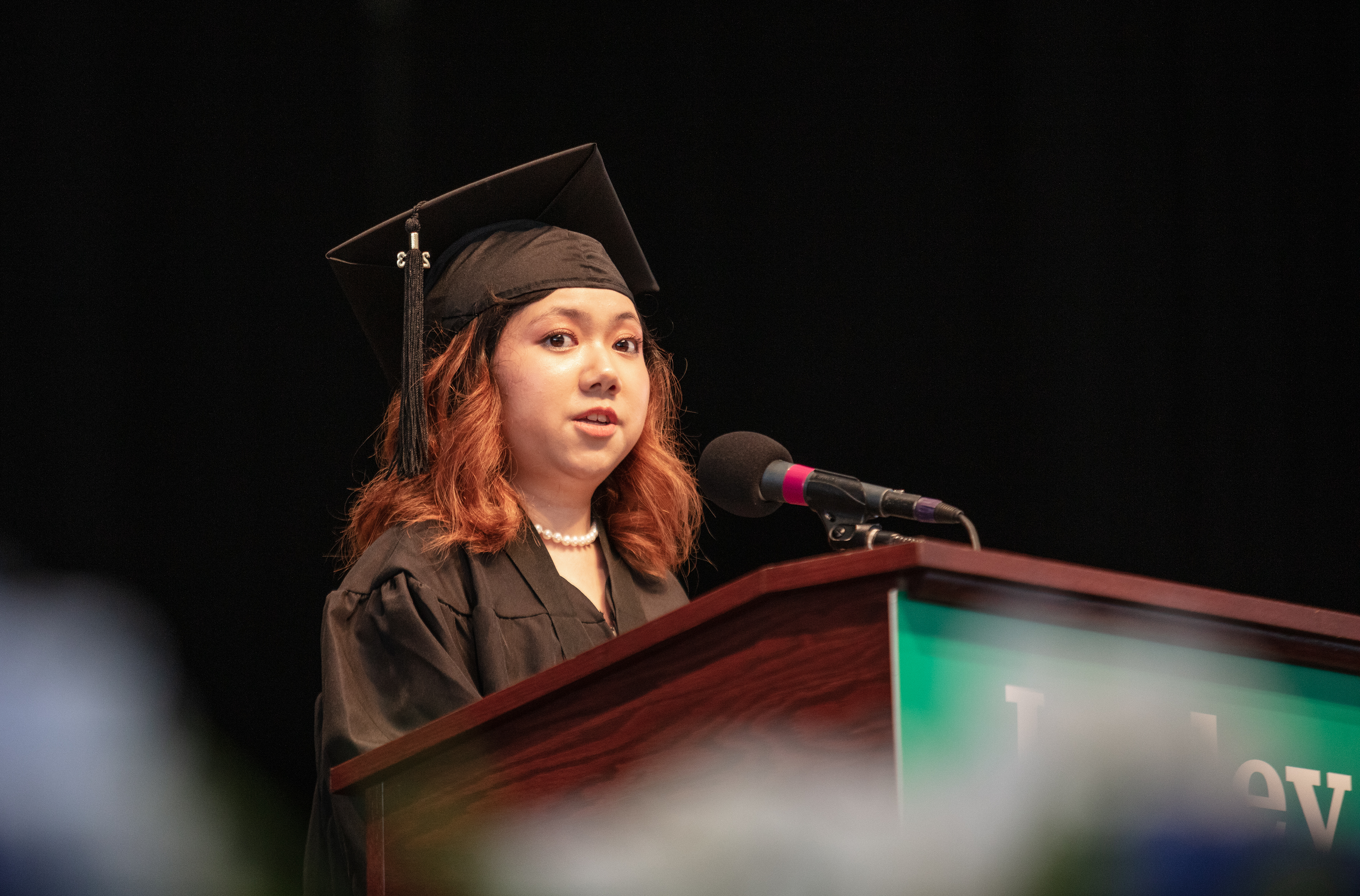 kirsten medina in graduation robe