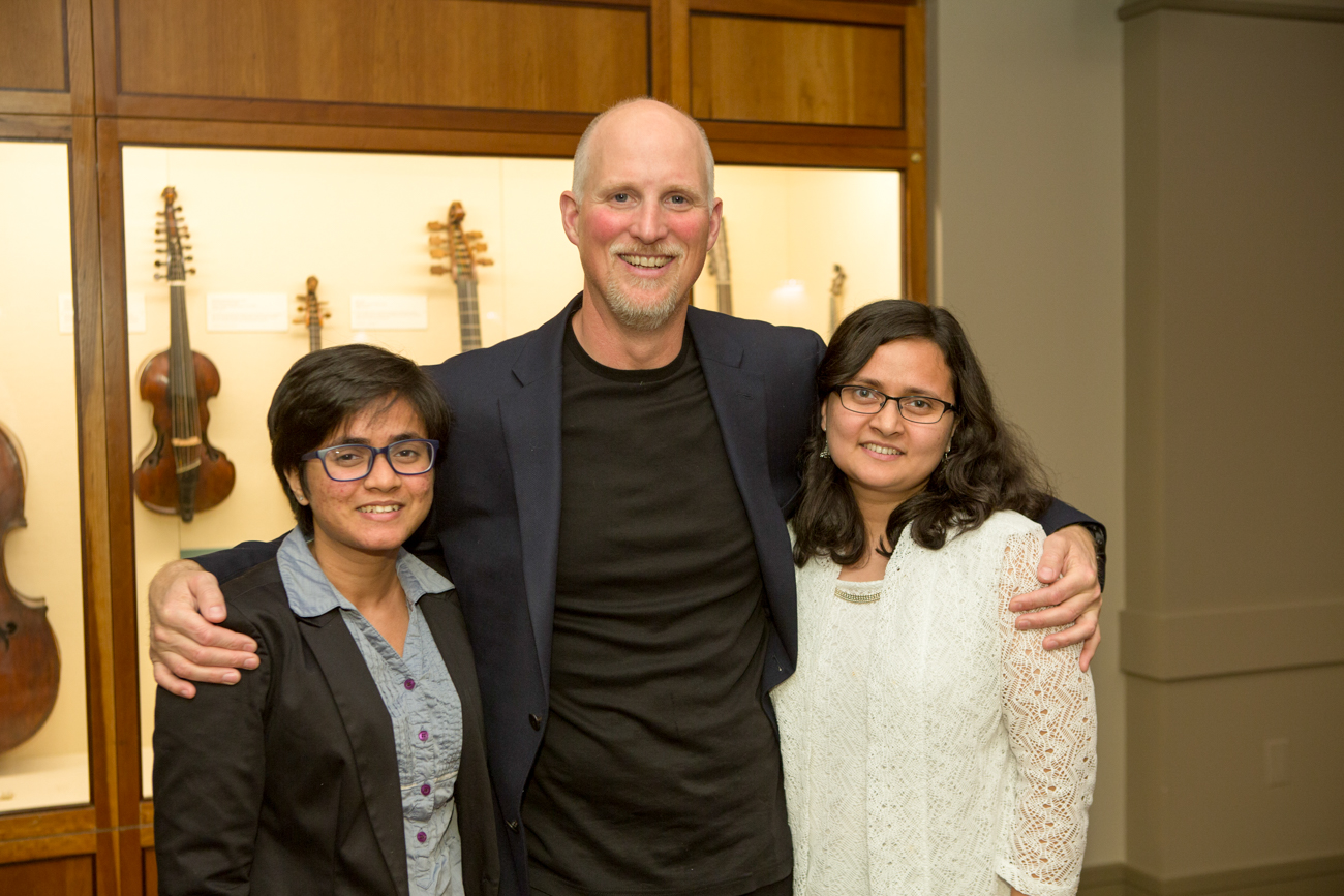 Paul Nicklen has his arms around two women, one Assistant Professor Nafisa Tanjeem.