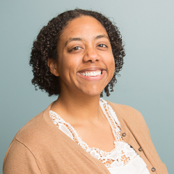 Headshot of Georgia Sparling smiling.