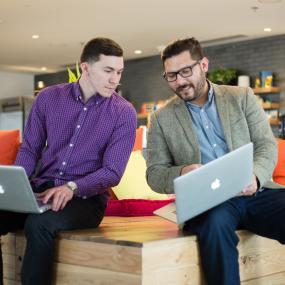student working with a mentor at an internship