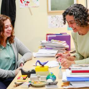 Teacher counseling student about academic resources