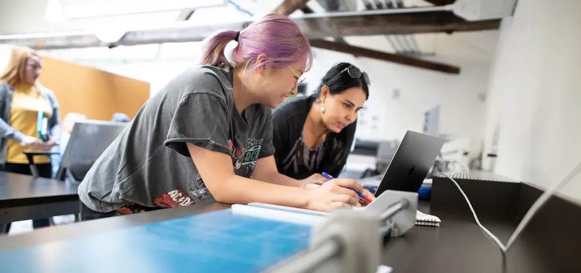 student and faculty working together