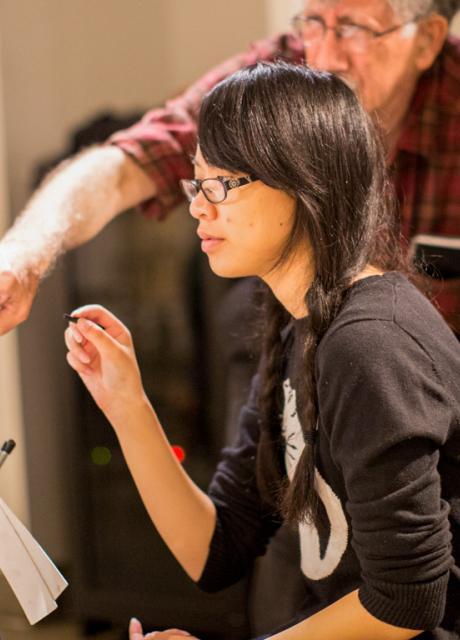 student and instructor in drawing class