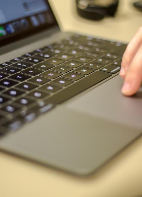 hand on laptop computer