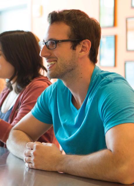 student in a meeting at their internship