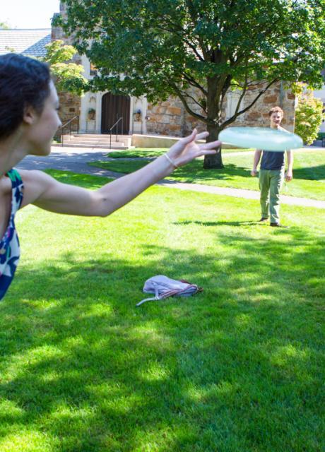 Student playing frisbee on South campus