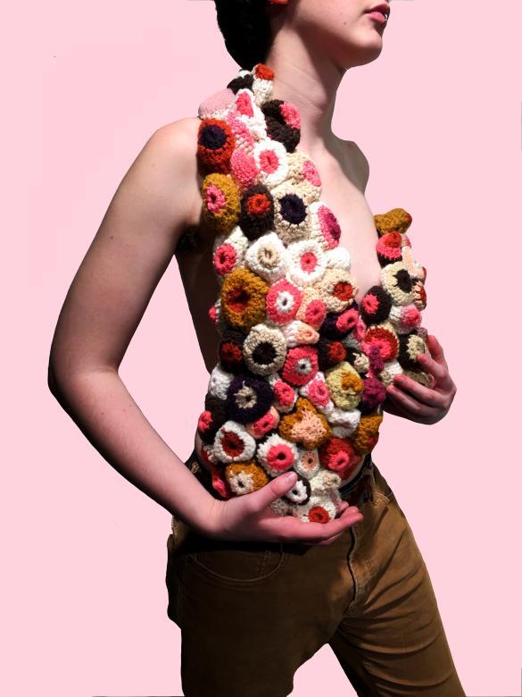 photograph of female wearing a crocheted vest 