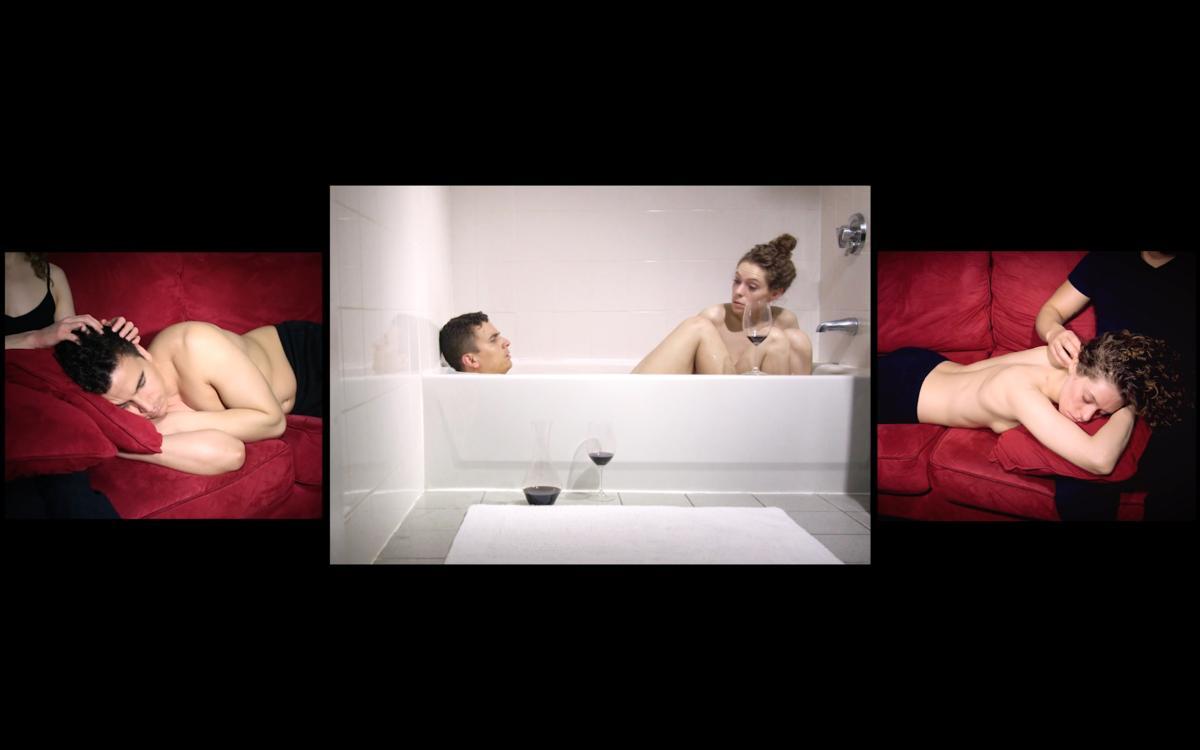 video still of male and female drinking wine in bath tub