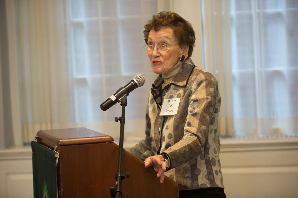 Pat Squire speaks at a podium in Alumni Hall