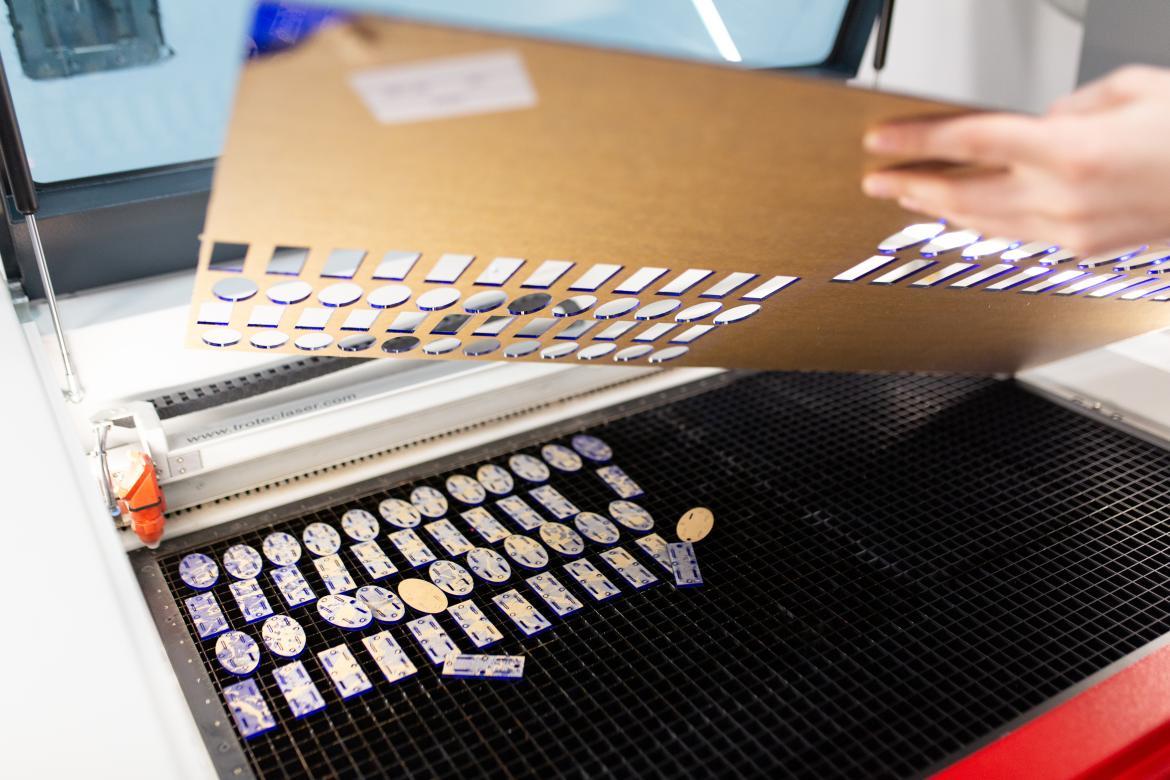 shapes being cut in the laser cutter