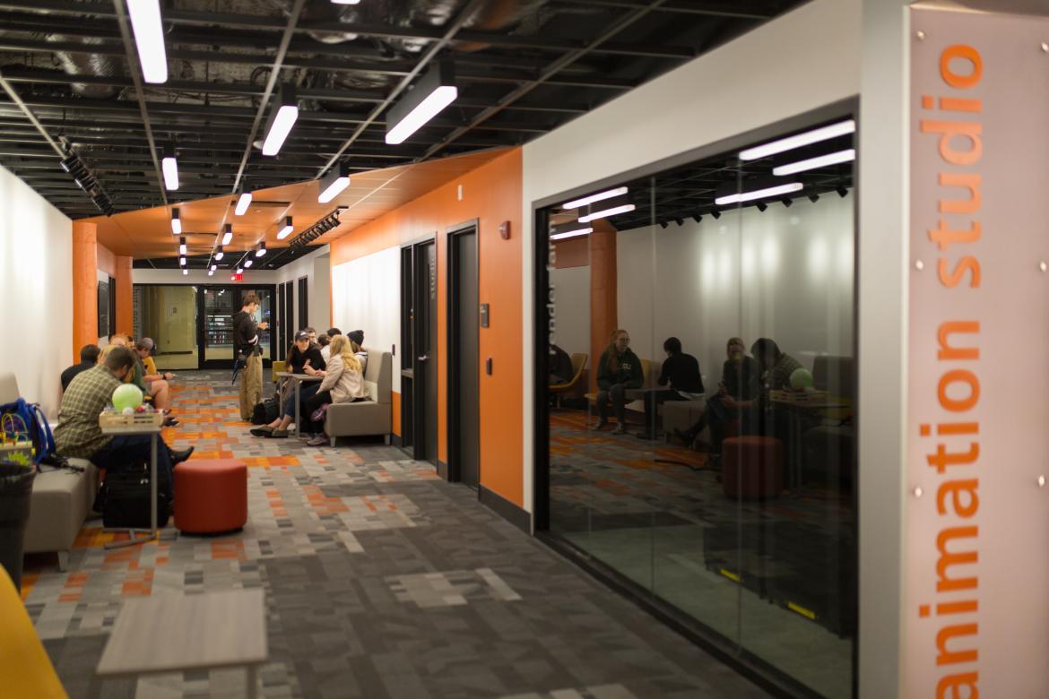 students in the orange animation hallway 
