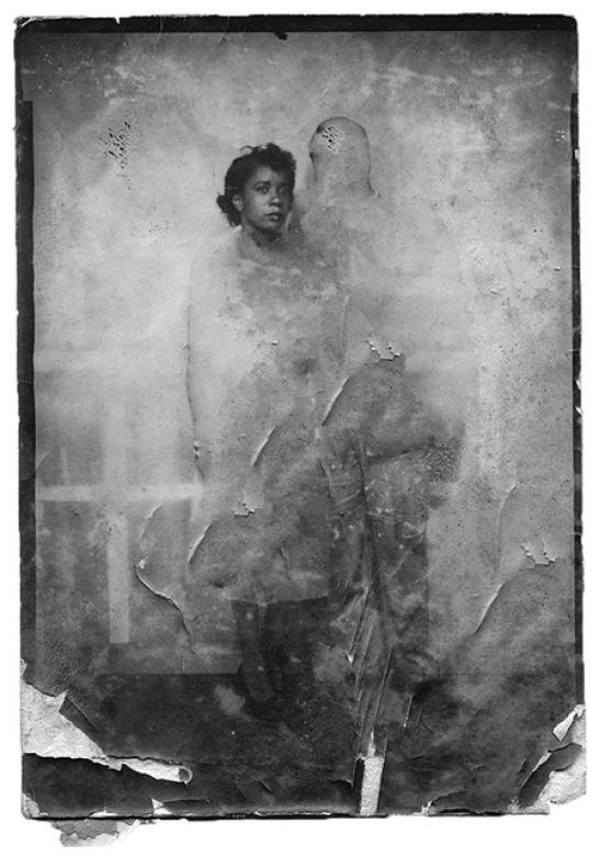 black and white photo of two people blurred out except for a woman's head
